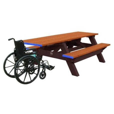 a Standard ADA outdoor park picnic table with wheelchair access on one end. Made with recycled HPDE plastic. Shown with a brown frame and cedar top and seat boards.